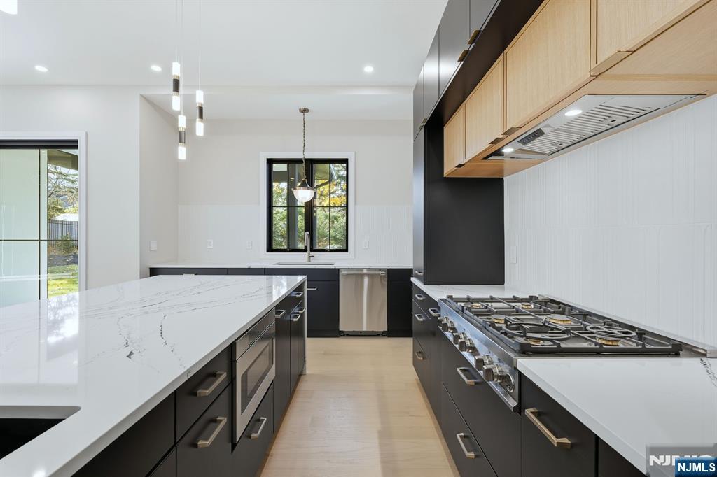 121 Engle Street Cresskill, NJ 07626 - Photo 17 of 50 a kitchen with a stove and a sink