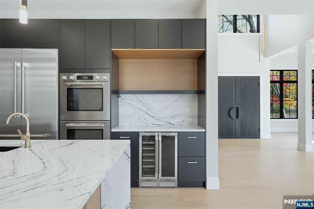 121 Engle Street Cresskill, NJ 07626 - Photo 18 of 50 a kitchen with stainless steel appliances a refrigerator and stove