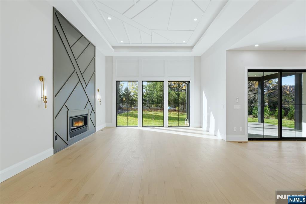 121 Engle Street Cresskill, NJ 07626 - Photo 22 of 50 a view of an empty room with a fireplace and a window