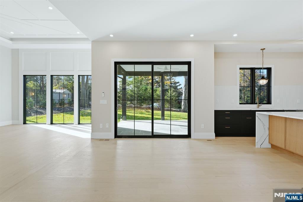 121 Engle Street Cresskill, NJ 07626 - Photo 23 of 50 a view of an empty room with a sliding door