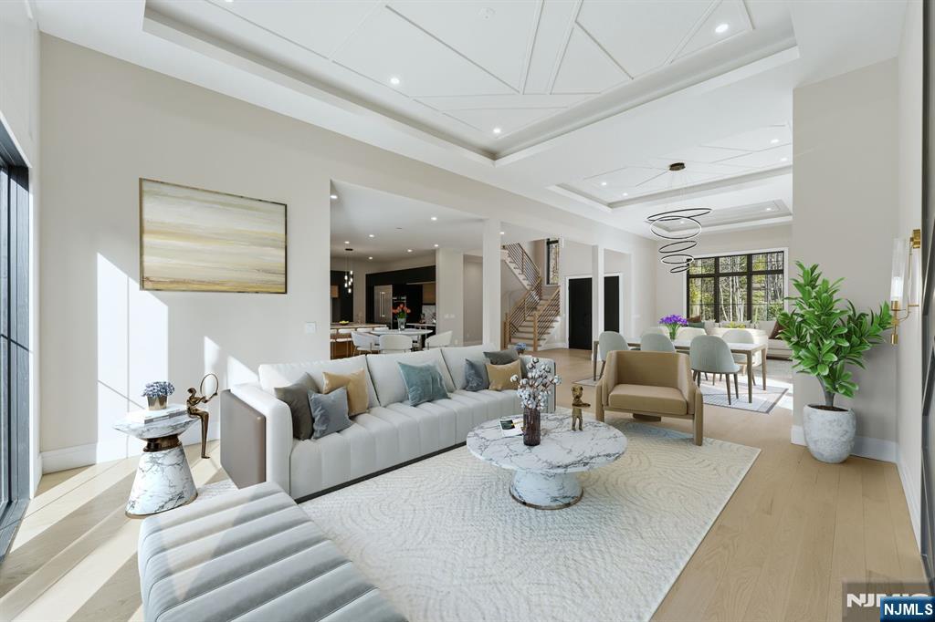 121 Engle Street Cresskill, NJ 07626 - Photo 3 of 50 a living room with furniture potted plant and a chandelier