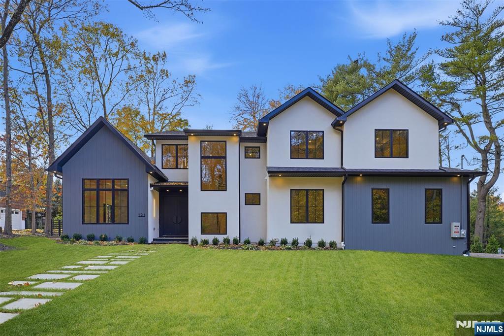 121 Engle Street Cresskill, NJ 07626 - Photo 8 of 50 a front view of a house with a garden