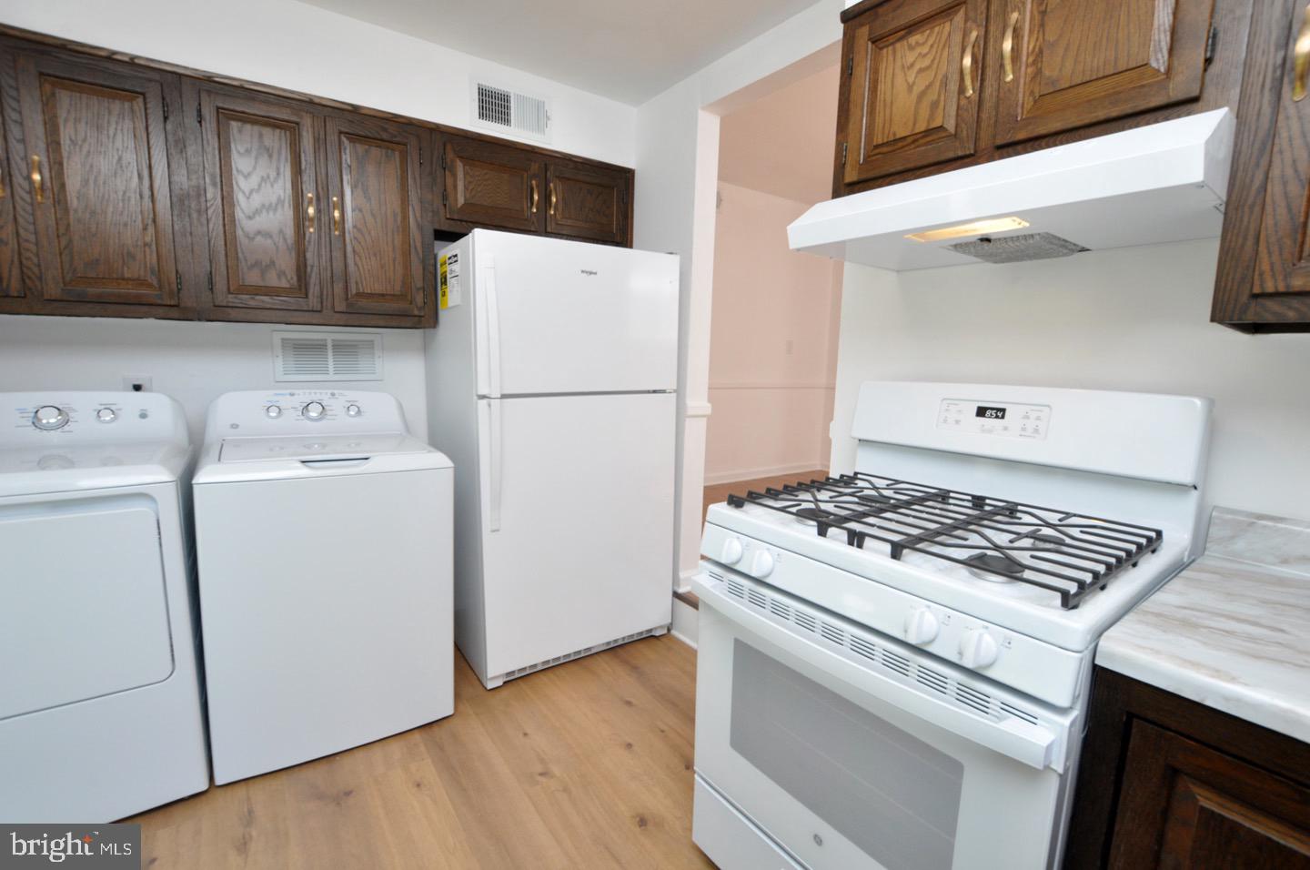 432 North Coles Avenue Maple Shade, NJ 08052 - Photo 12 of 26 a kitchen with a stove and a refrigerator