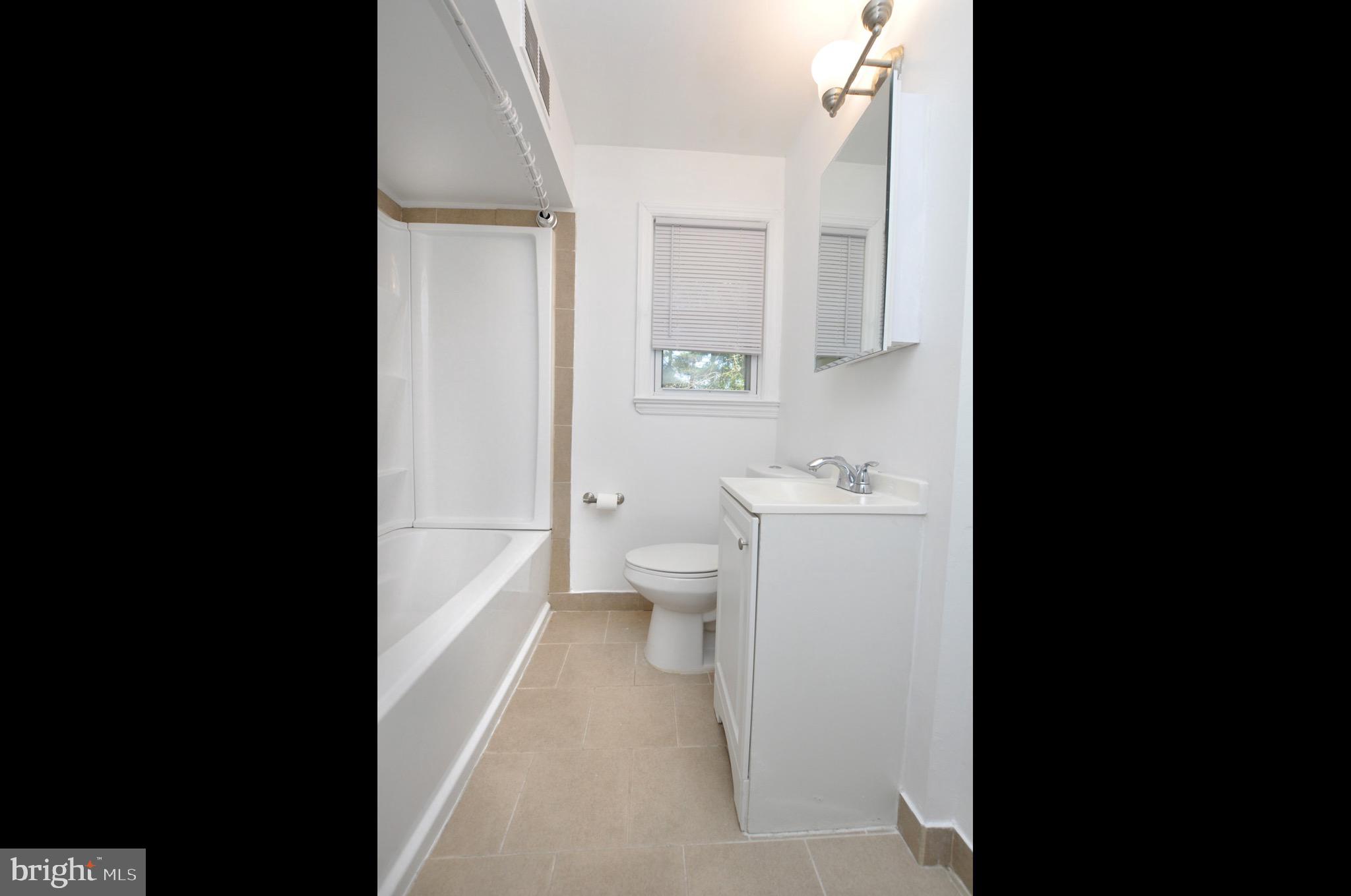 432 North Coles Avenue Maple Shade, NJ 08052 - Photo 14 of 26 a bathroom with a sink a toilet and a mirror
