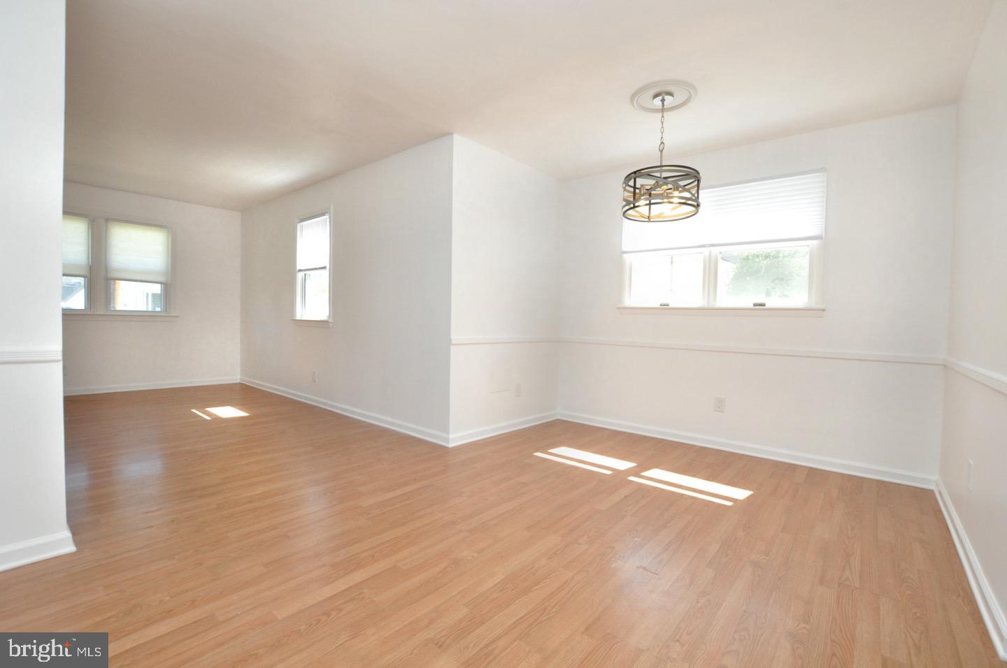 432 North Coles Avenue Maple Shade, NJ 08052 - Photo 5 of 26 an empty room with wooden floor and windows