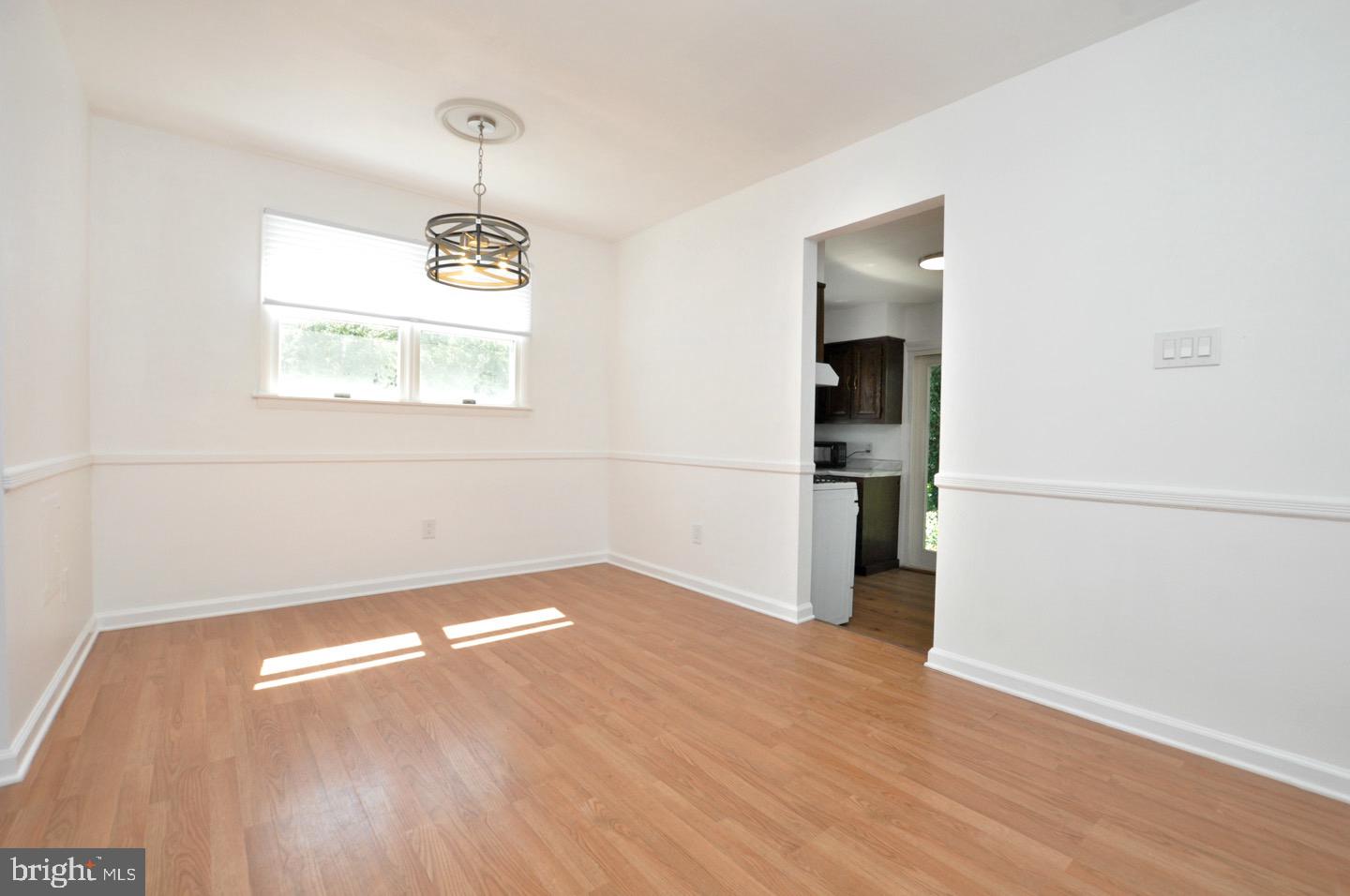 432 North Coles Avenue Maple Shade, NJ 08052 - Photo 6 of 26 an empty room with wooden floor and windows