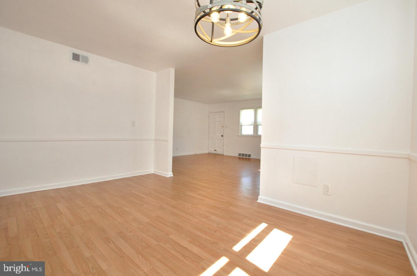 432 North Coles Avenue Maple Shade, NJ 08052 - Photo 7 of 26 an empty room with wooden floor and windows