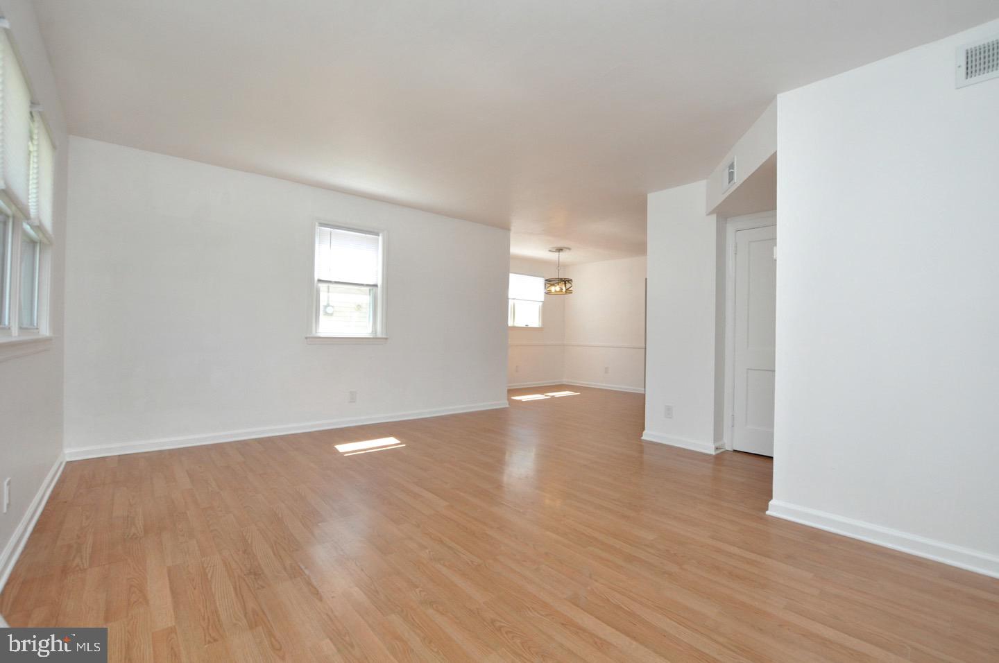432 North Coles Avenue Maple Shade, NJ 08052 - Photo 8 of 26 a view of an empty room with wooden floor and a window