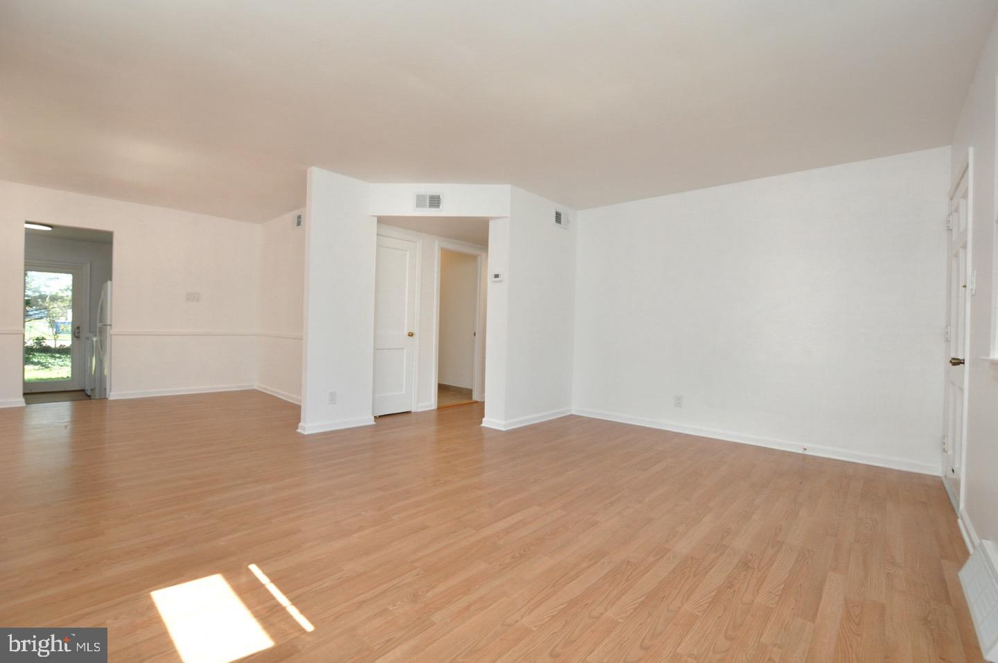 432 North Coles Avenue Maple Shade, NJ 08052 - Photo 9 of 26 a view of empty room with wooden floor and fan