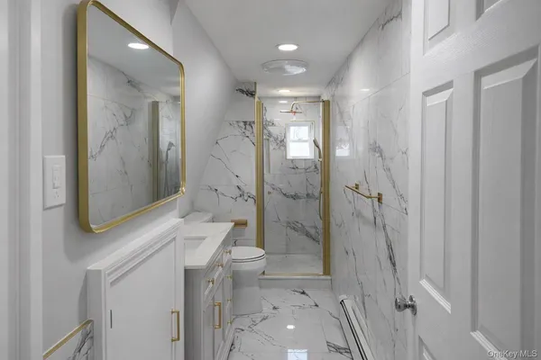 a bathroom with a shower and a sink