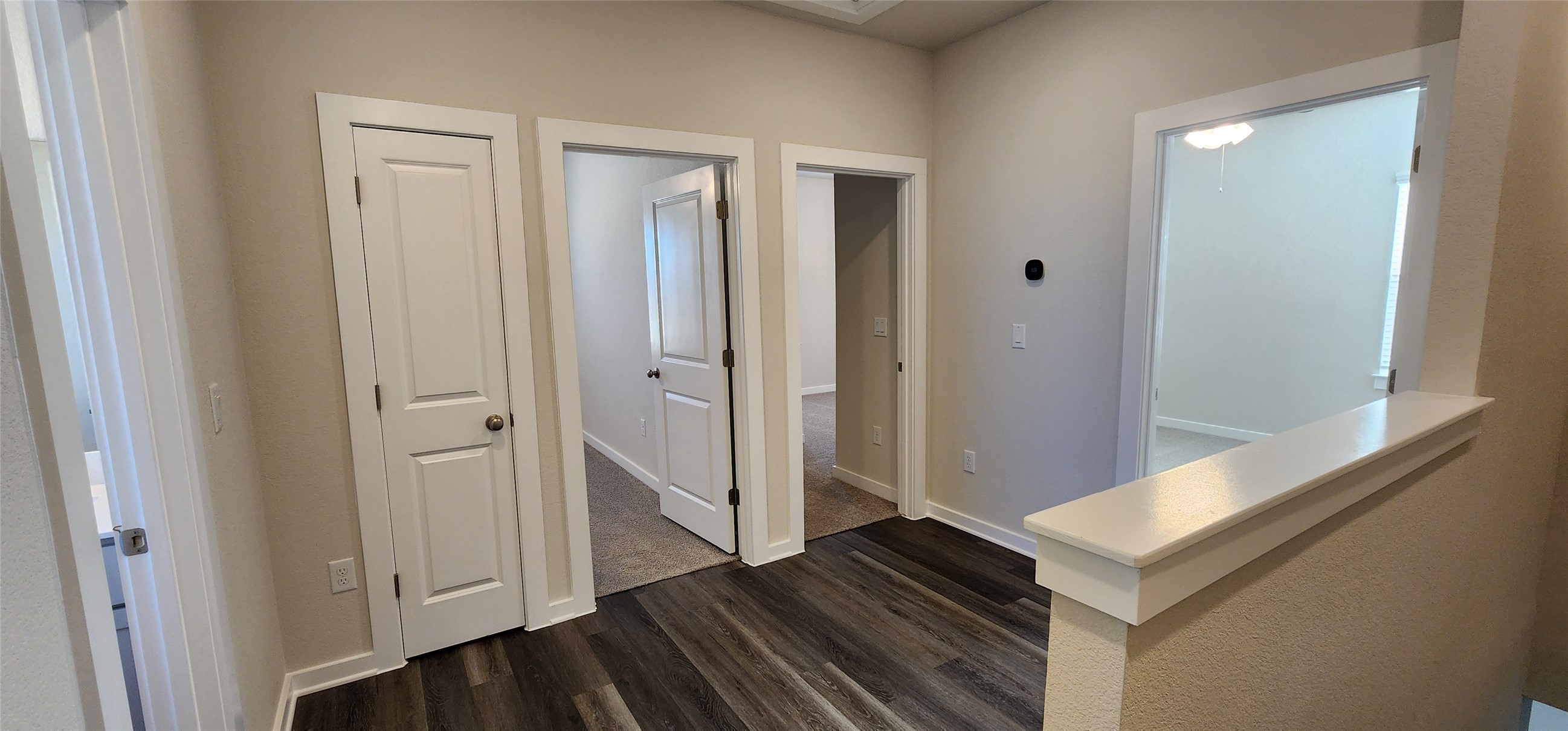 2248 Delano Drive Leander, TX 78641 - Photo 17 of 33 Hallway with baseboards and dark wood finished floors