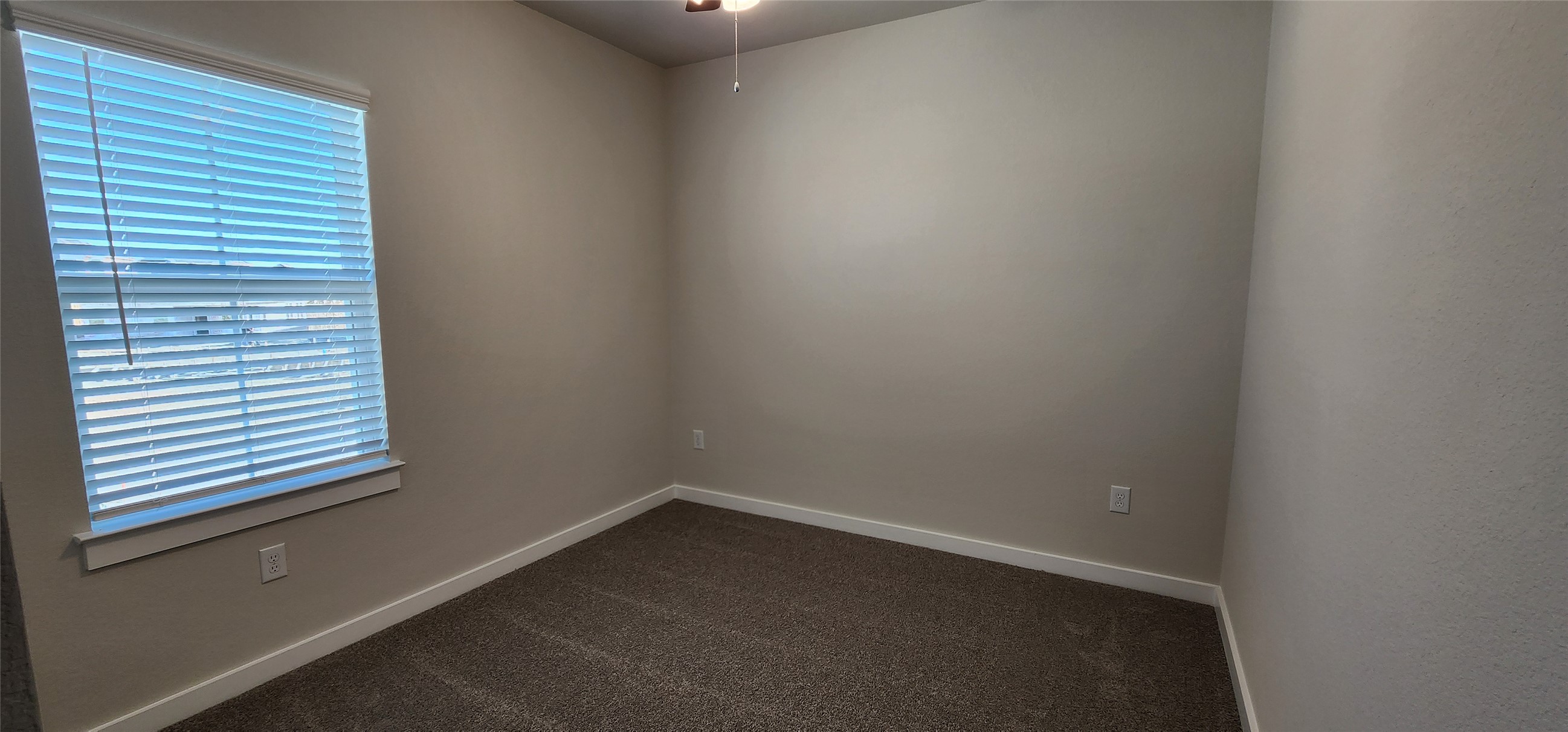2248 Delano Drive Leander, TX 78641 - Photo 24 of 33 Unfurnished room with dark carpet and ceiling fan
