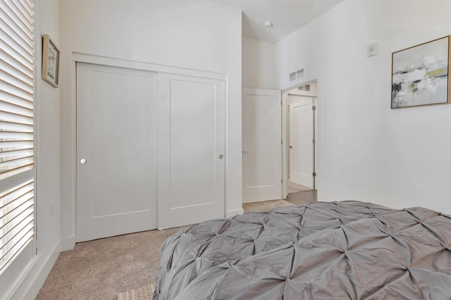 390 Riesling Avenue, Unit 30 Milpitas, CA 95035 - Photo 20 of 37 a view of a bedroom with a bed and a window