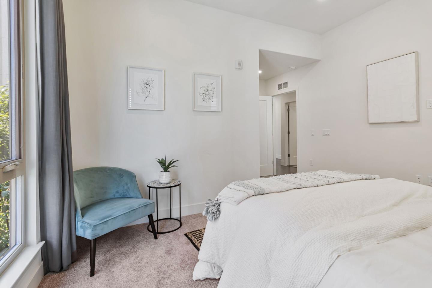 390 Riesling Avenue, Unit 30 Milpitas, CA 95035 - Photo 23 of 37 a bedroom with a bed and a couch next to a window