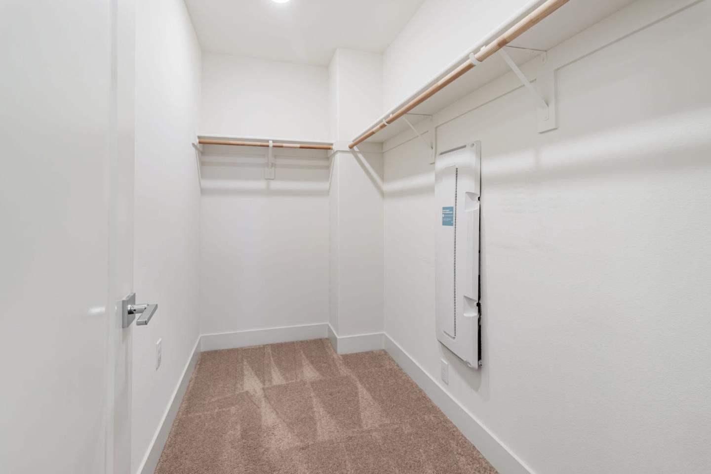 390 Riesling Avenue, Unit 30 Milpitas, CA 95035 - Photo 26 of 37 a view of a room with racks on the wall