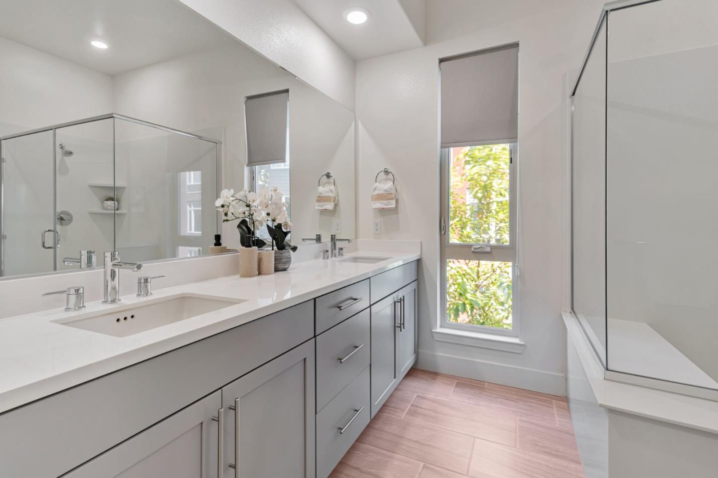 390 Riesling Avenue, Unit 30 Milpitas, CA 95035 - Photo 27 of 37 a bathroom with a double vanity sink and a mirror
