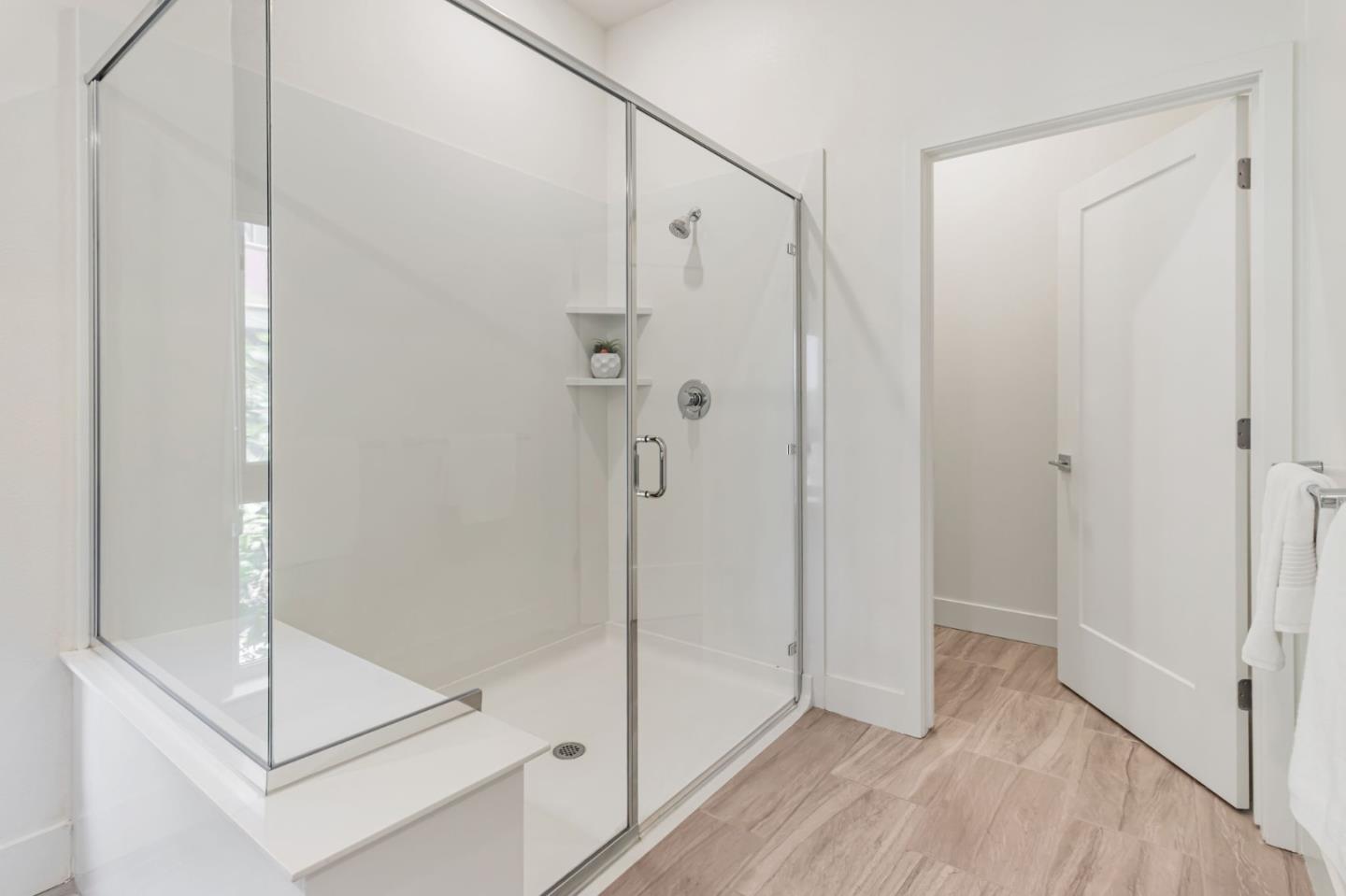 390 Riesling Avenue, Unit 30 Milpitas, CA 95035 - Photo 28 of 37 a bathroom with a shower and a glass door