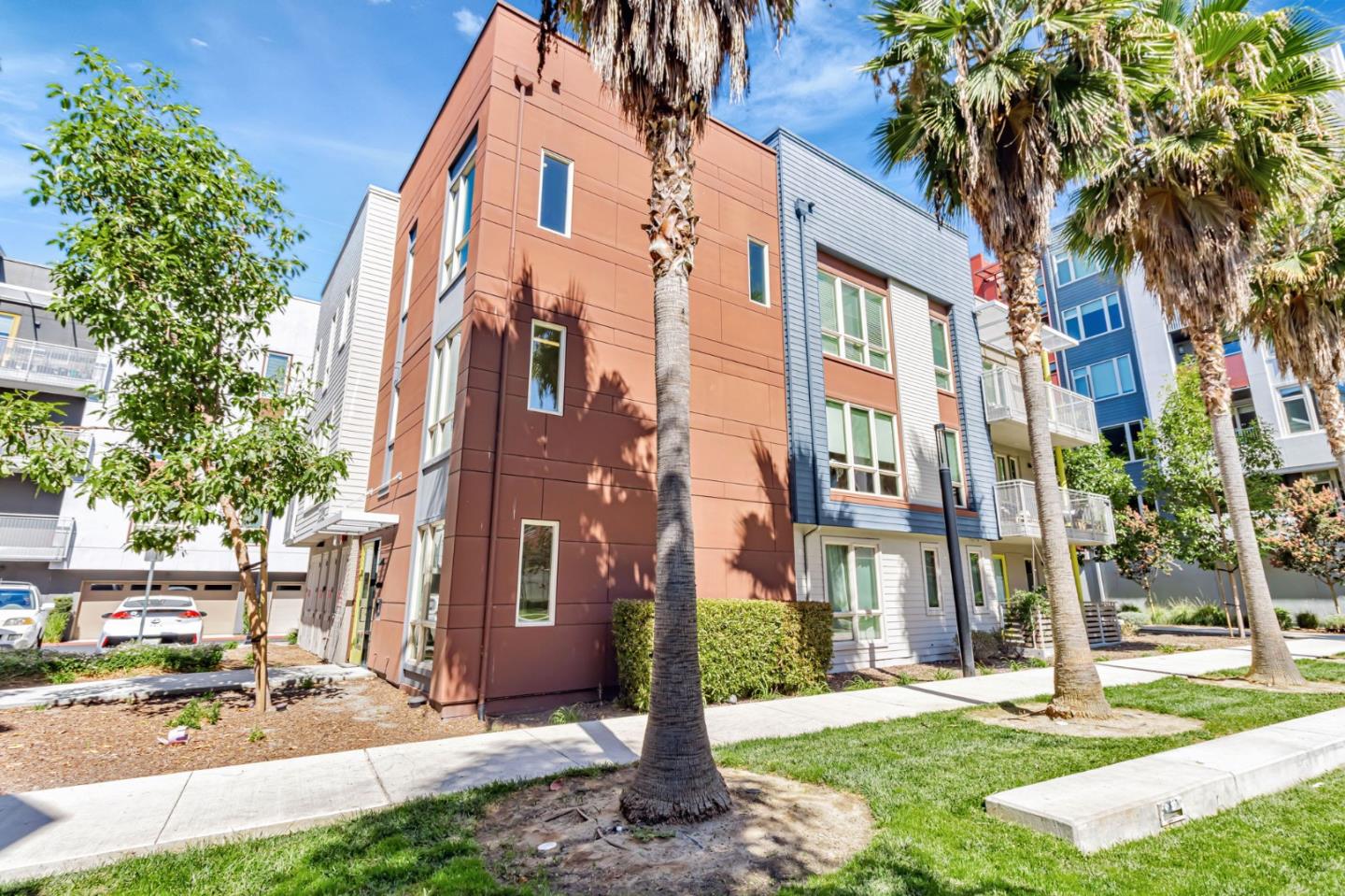 390 Riesling Avenue, Unit 30 Milpitas, CA 95035 - Photo 34 of 37 a view of a building with a yard