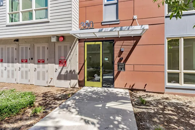 a view of a backyard with a large tree