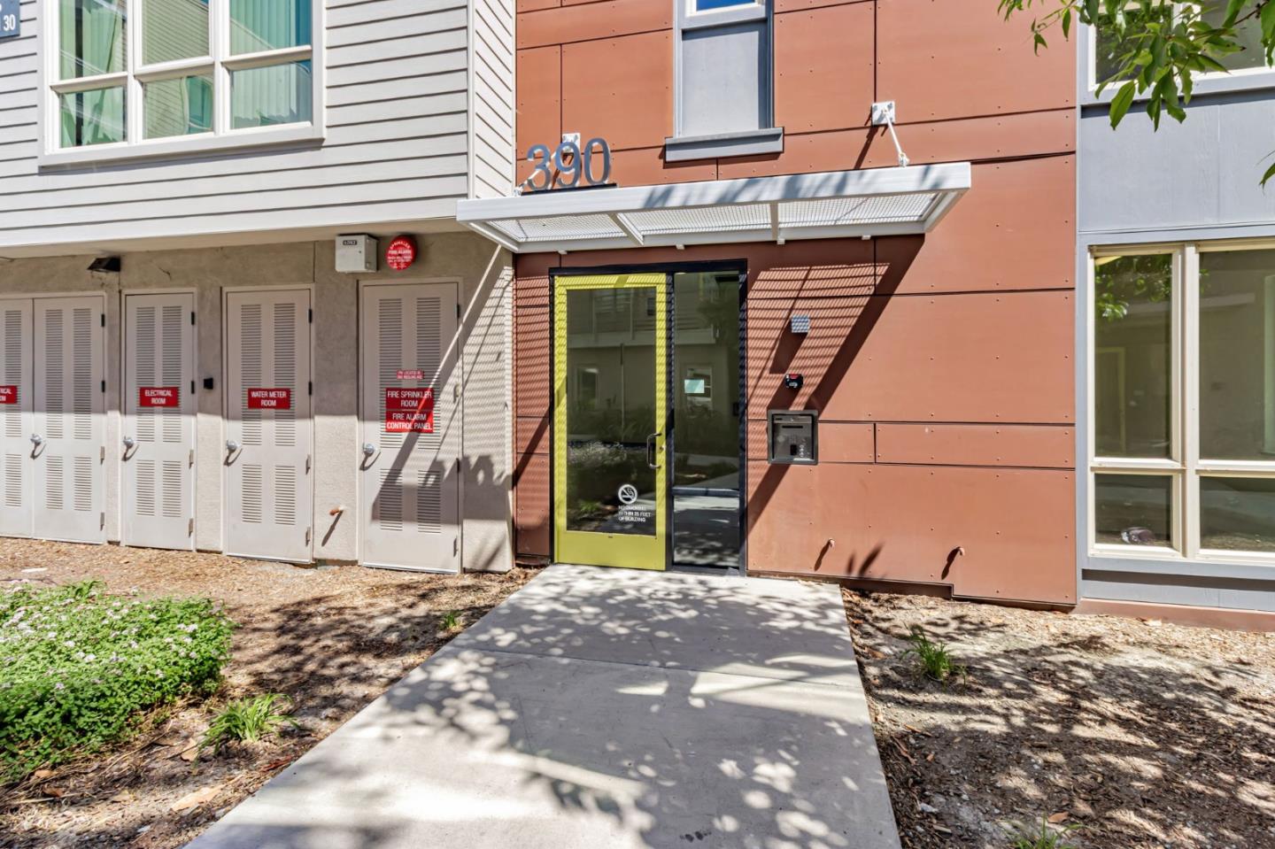 390 Riesling Avenue, Unit 30 Milpitas, CA 95035 - Photo 4 of 37 a view of a backyard with a large tree