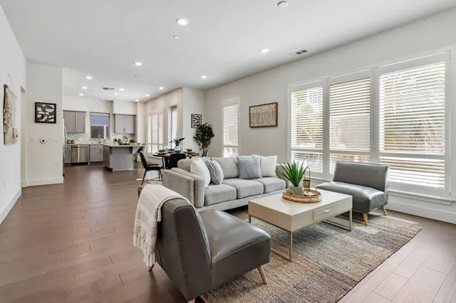 a living room with furniture and a table