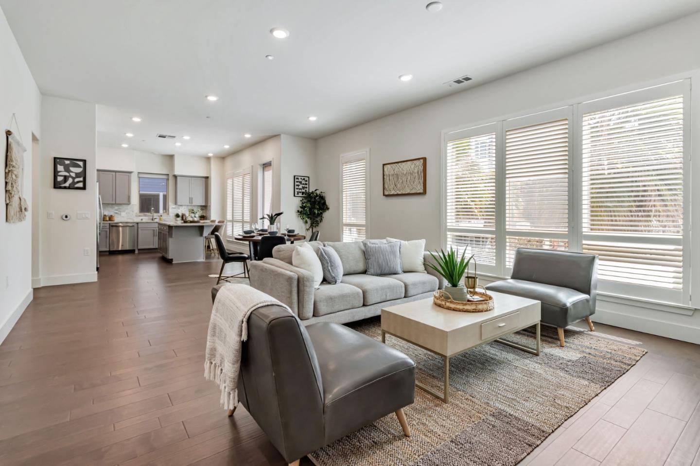 390 Riesling Avenue, Unit 30 Milpitas, CA 95035 - Photo 7 of 37 a living room with furniture and a table