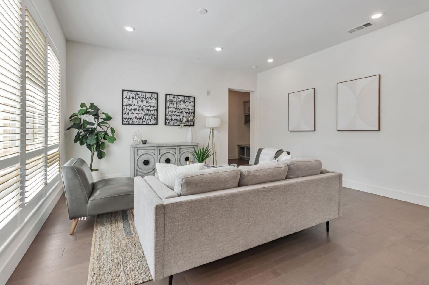 390 Riesling Avenue, Unit 30 Milpitas, CA 95035 - Photo 9 of 37 a living room with furniture and a large window