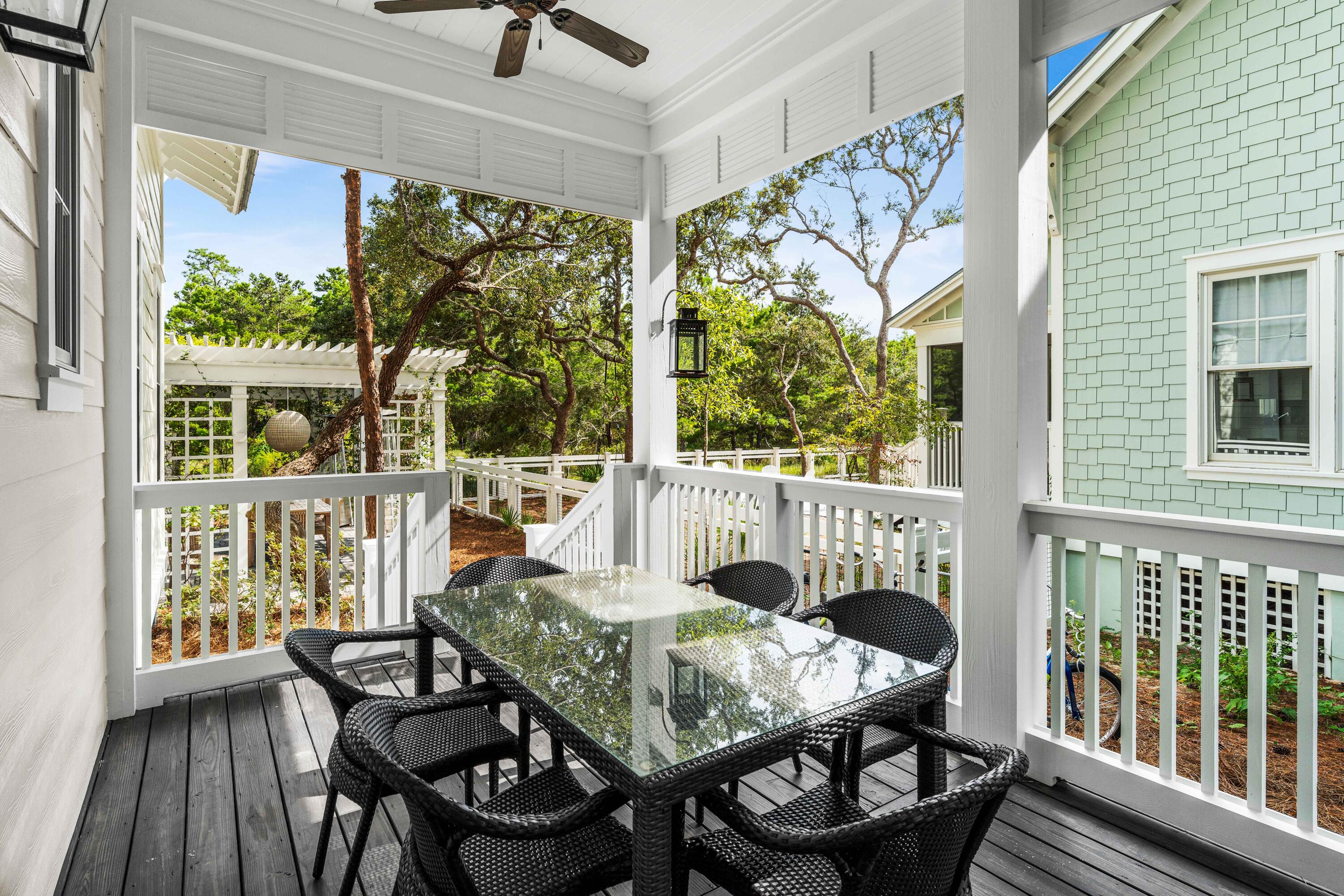 406 Red Cedar Way Santa Rosa Beach, FL 32459 - Photo 14 of 60 a balcony view with a seating space and a garden