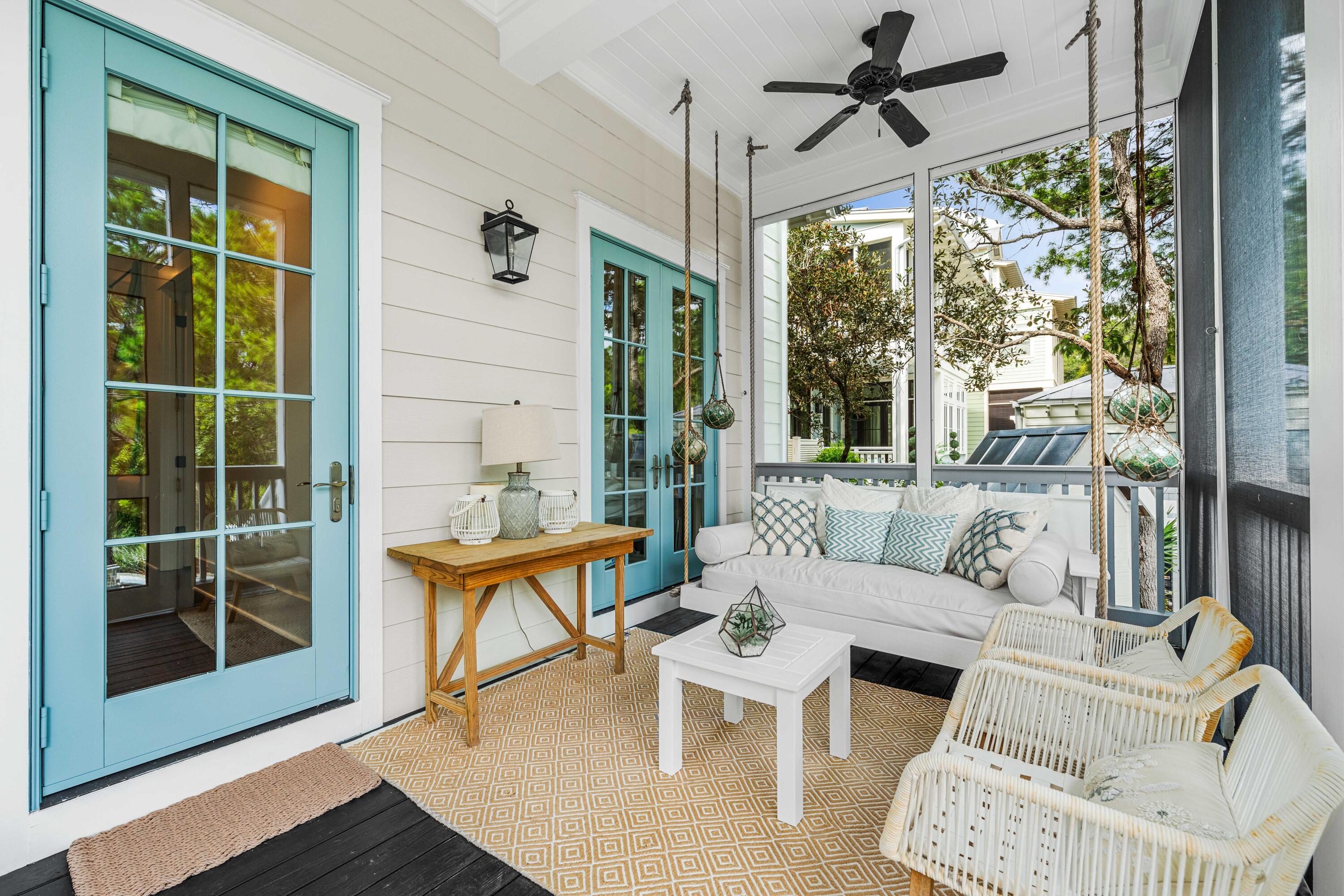 406 Red Cedar Way Santa Rosa Beach, FL 32459 - Photo 17 of 60 a living room with furniture a lamp and a large window