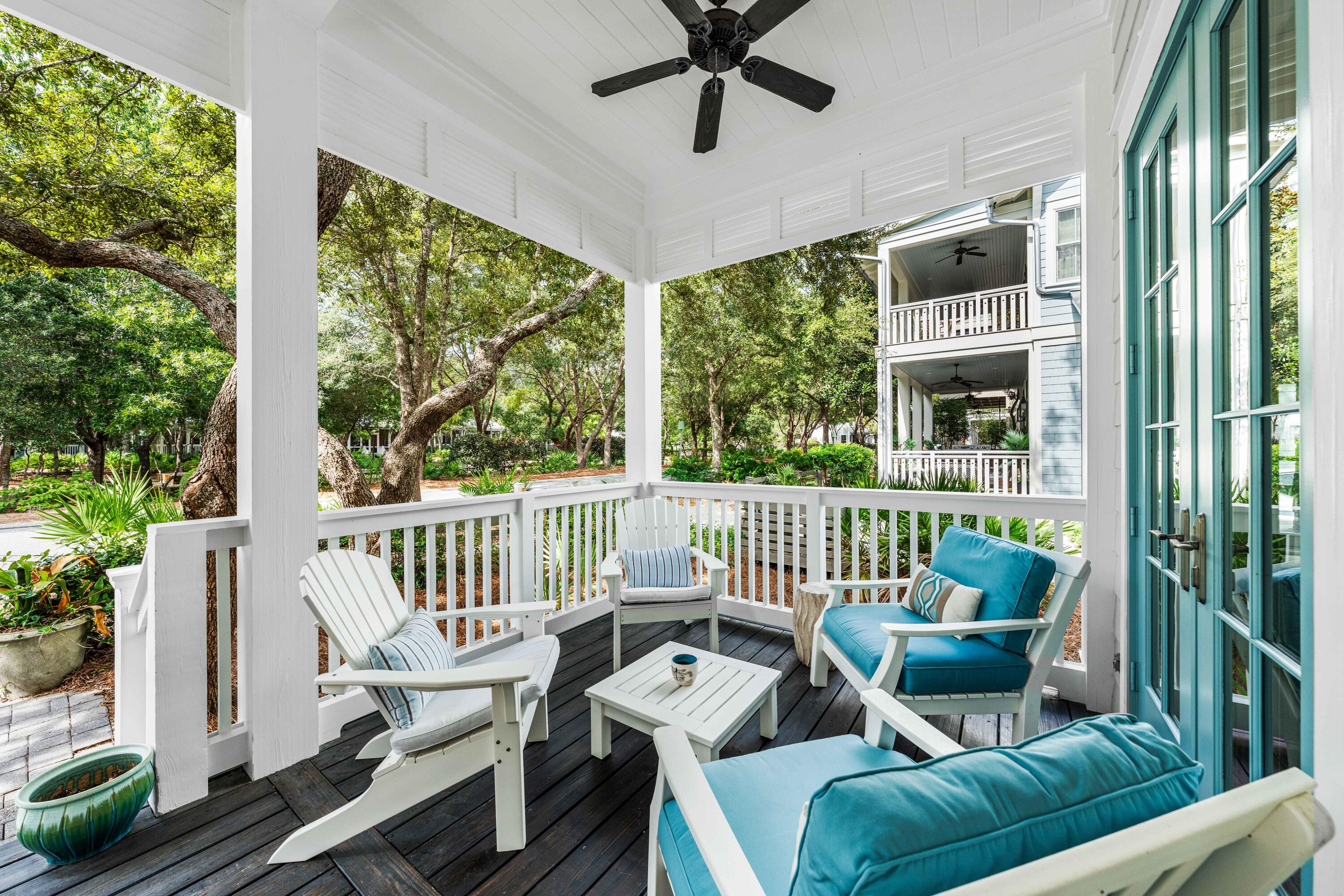 406 Red Cedar Way Santa Rosa Beach, FL 32459 - Photo 21 of 60 a view of a chair and tables in the balcony