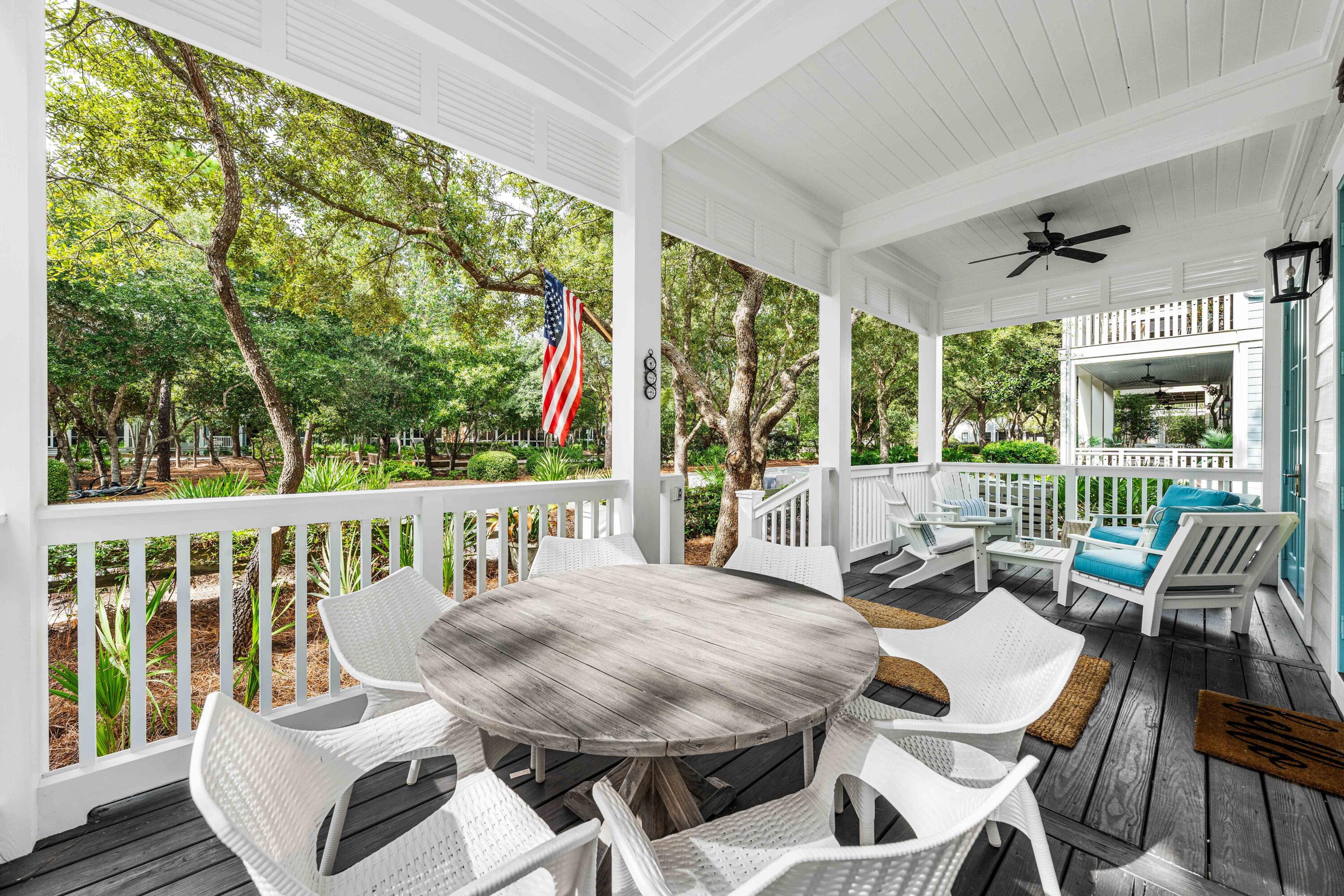 406 Red Cedar Way Santa Rosa Beach, FL 32459 - Photo 23 of 60 a view of a patio with a table chairs and a yard