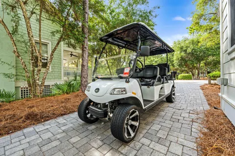 a view of a livingroom with furniture wooden floor and a chandelier