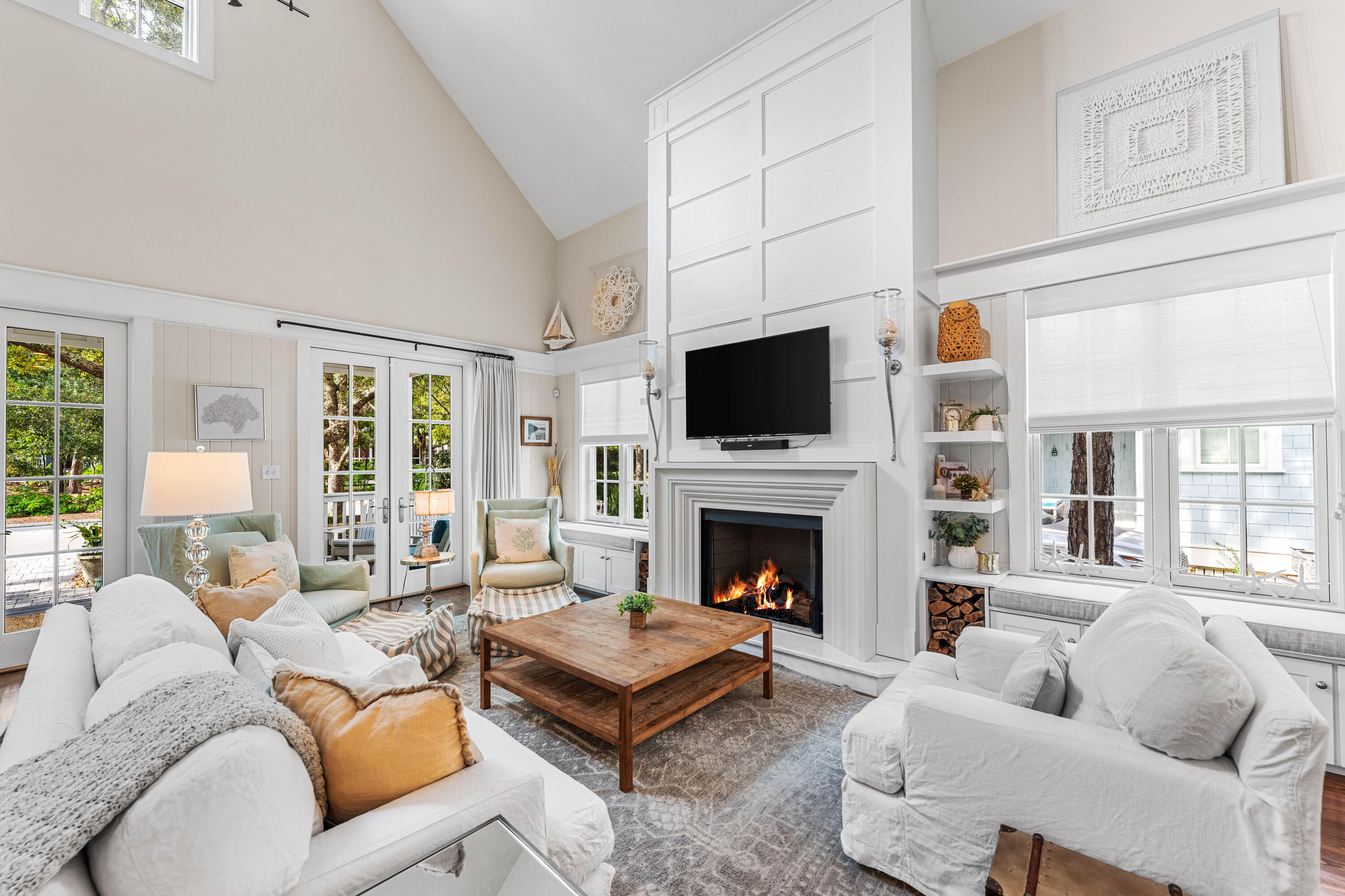 406 Red Cedar Way Santa Rosa Beach, FL 32459 - Photo 27 of 60 a living room with furniture a flat screen tv and a fireplace