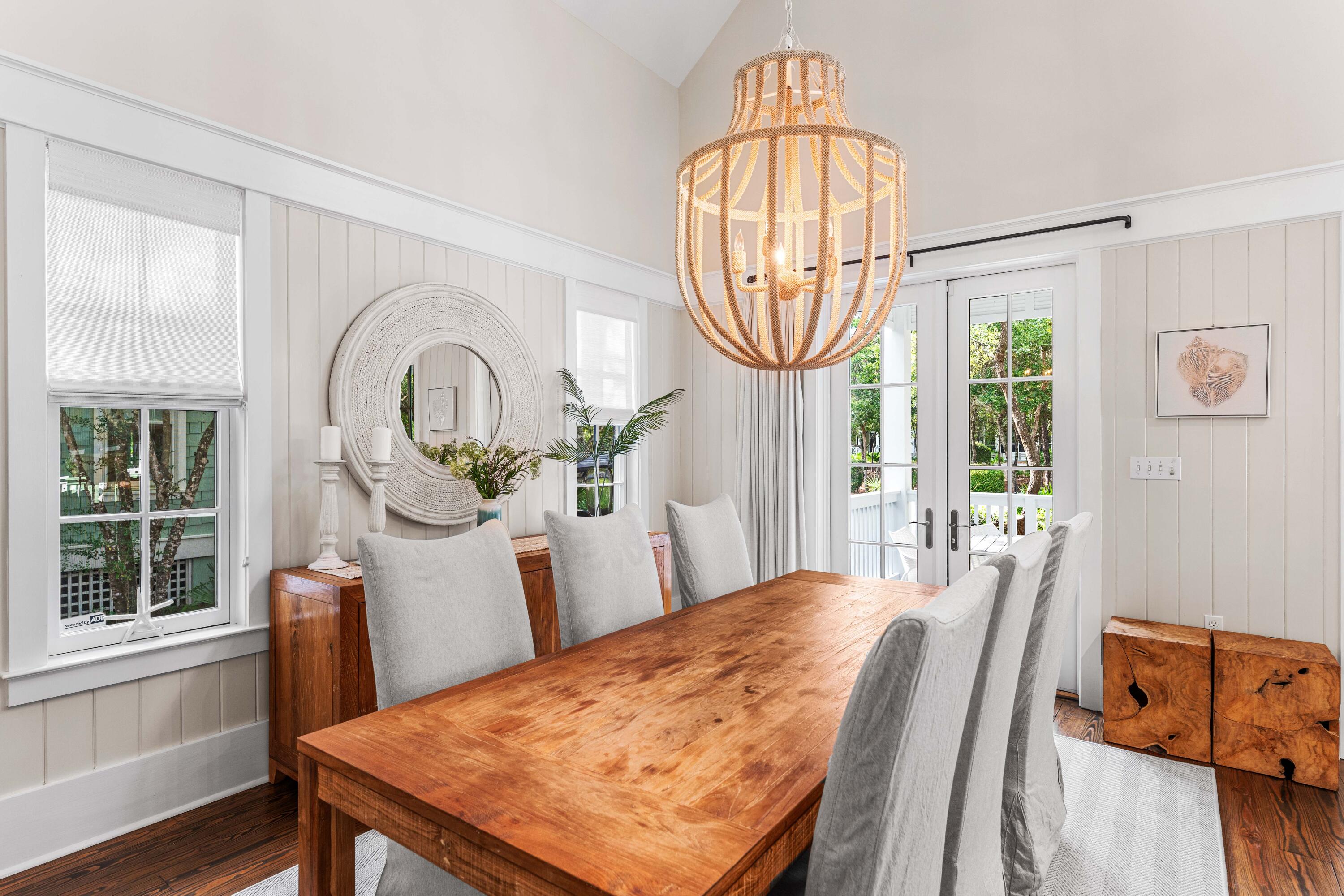 406 Red Cedar Way Santa Rosa Beach, FL 32459 - Photo 33 of 60 a view of a dining room with furniture window and wooden floor