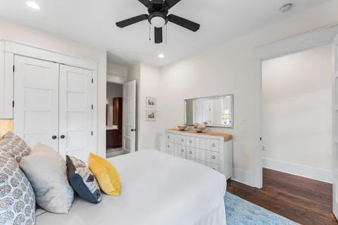 a bedroom with a bed and a lamp