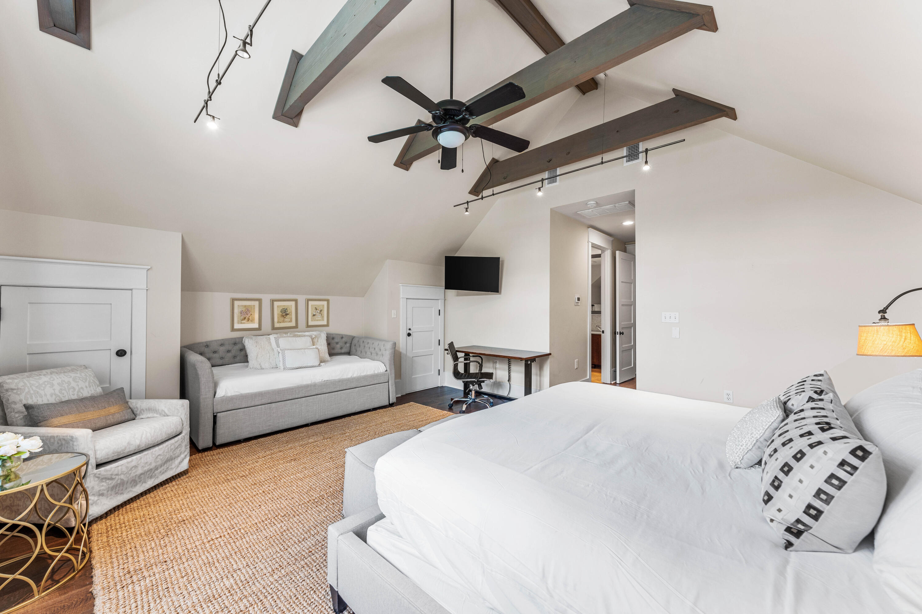 406 Red Cedar Way Santa Rosa Beach, FL 32459 - Photo 56 of 60 a bedroom with a bed a couch and a chandelier