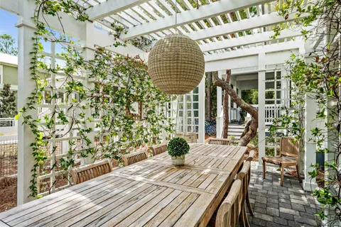 a view of balcony with wooden floor and outdoor seating