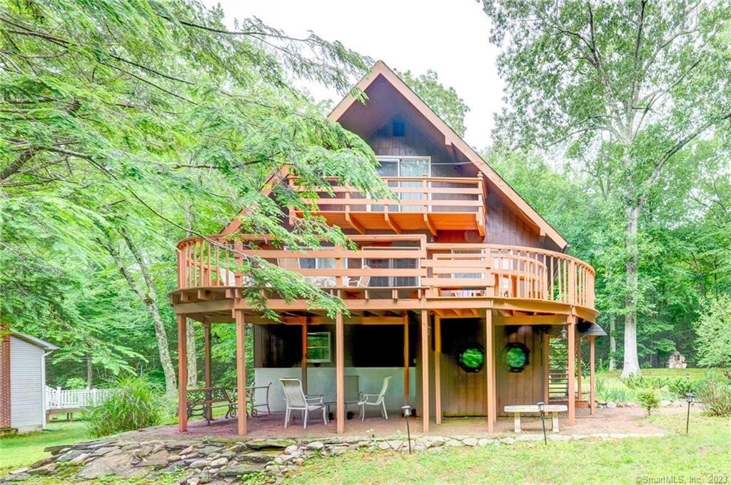 72 Bausola Road Andover, CT 06232 - Photo 1 of 1 a view of a house with yard and sitting area