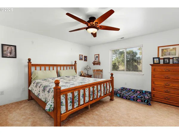 a bed room with a bed and a window