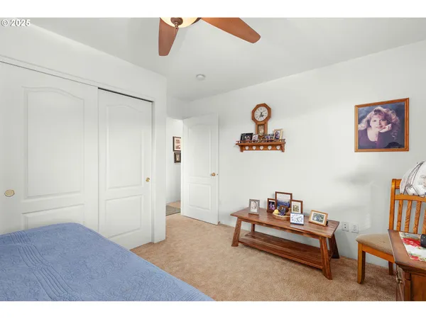 a bedroom with furniture and a window