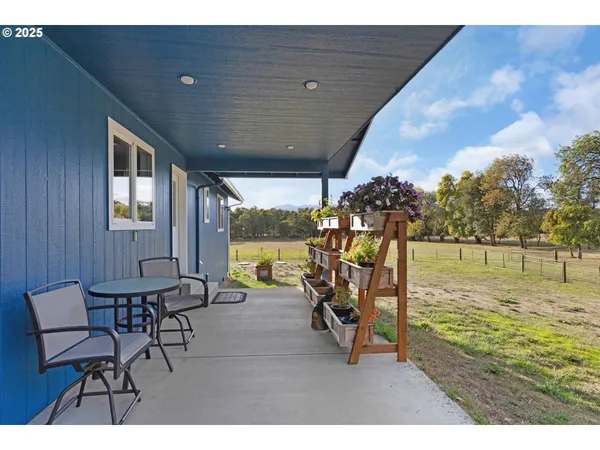 a view of a chairs and table on the terrace