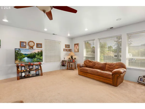 a living room with furniture and a large window