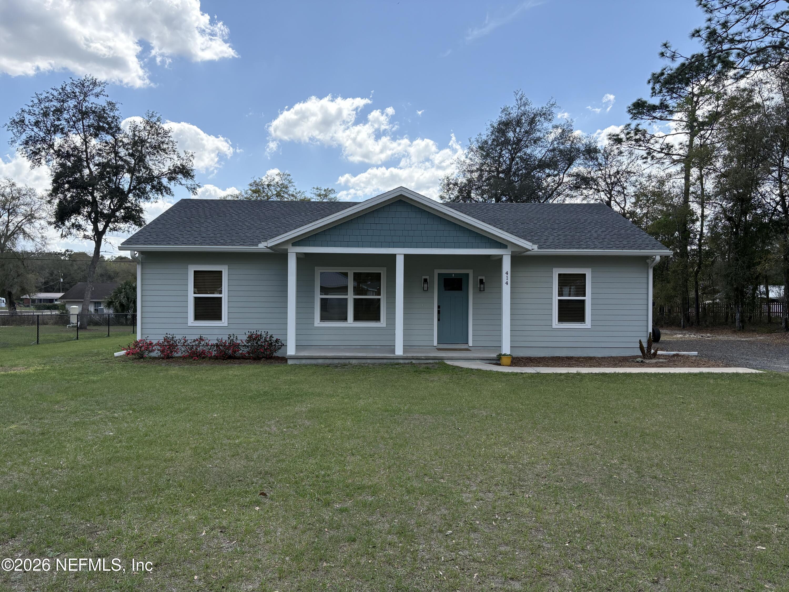 414 Southeast 72nd Street Starke, FL 32091 - Photo 1 of 1 a front view of a house with a garden