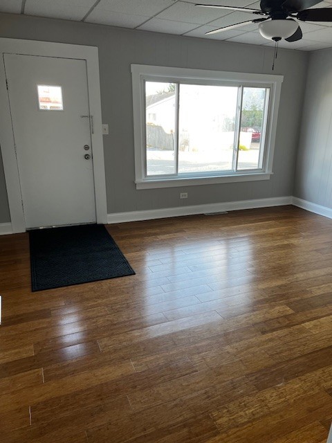 146 East Mill Street Wauconda, IL 60084 - Photo 2 of 17 an empty room with wooden floor and windows