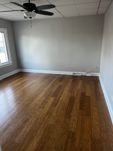 146 East Mill Street Wauconda, IL 60084 - Photo 3 of 17 an empty room with wooden floor and windows