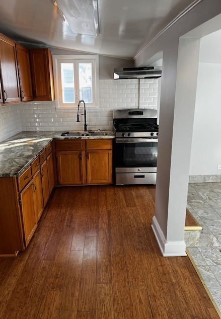 146 East Mill Street Wauconda, IL 60084 - Photo 5 of 17 a kitchen with granite countertop a stove and a sink