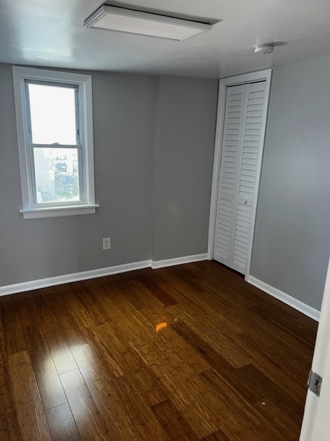 146 East Mill Street Wauconda, IL 60084 - Photo 9 of 17 an empty room with wooden floor and windows