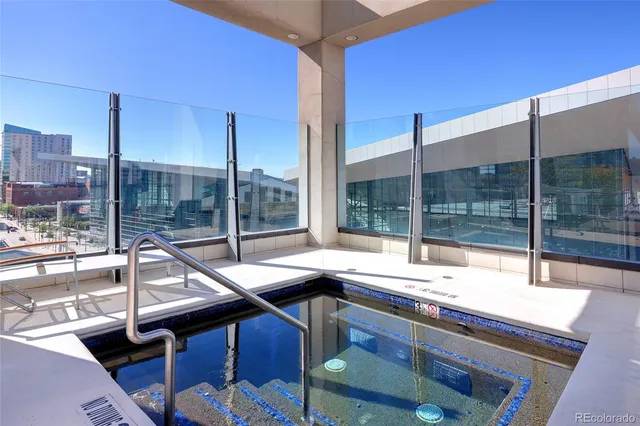 a room with a large window and a table