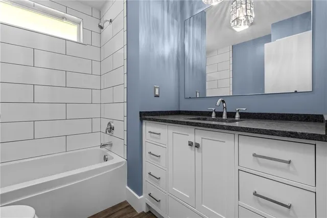 a bathroom with a sink and a bathtub