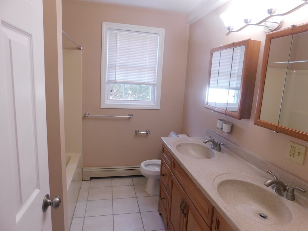 5 Progress Street, Unit 2 Fall River, MA 02721 - Photo 9 of 17 a bathroom with a sink toilet and mirror